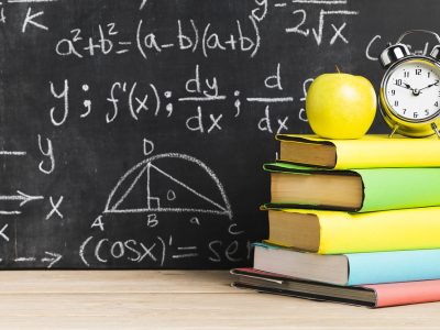 school desk with textbooks near blackboard . Resolution and high quality beautiful photo