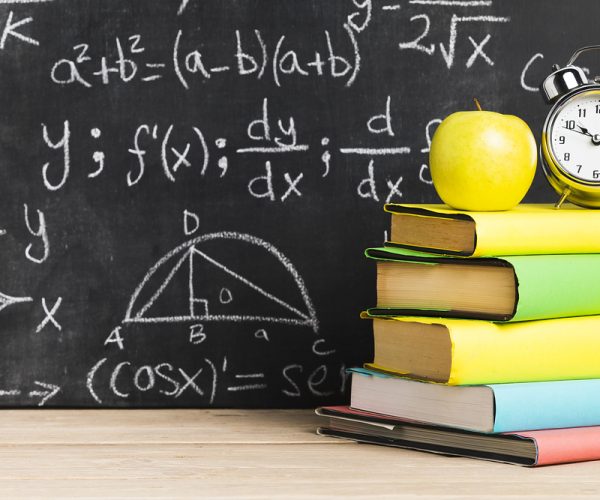 school desk with textbooks near blackboard . Resolution and high quality beautiful photo